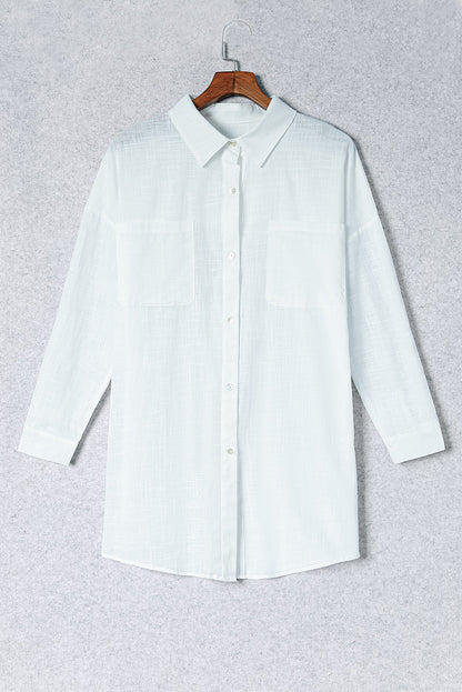 Chemise longue boutonnée avec poches poitrine