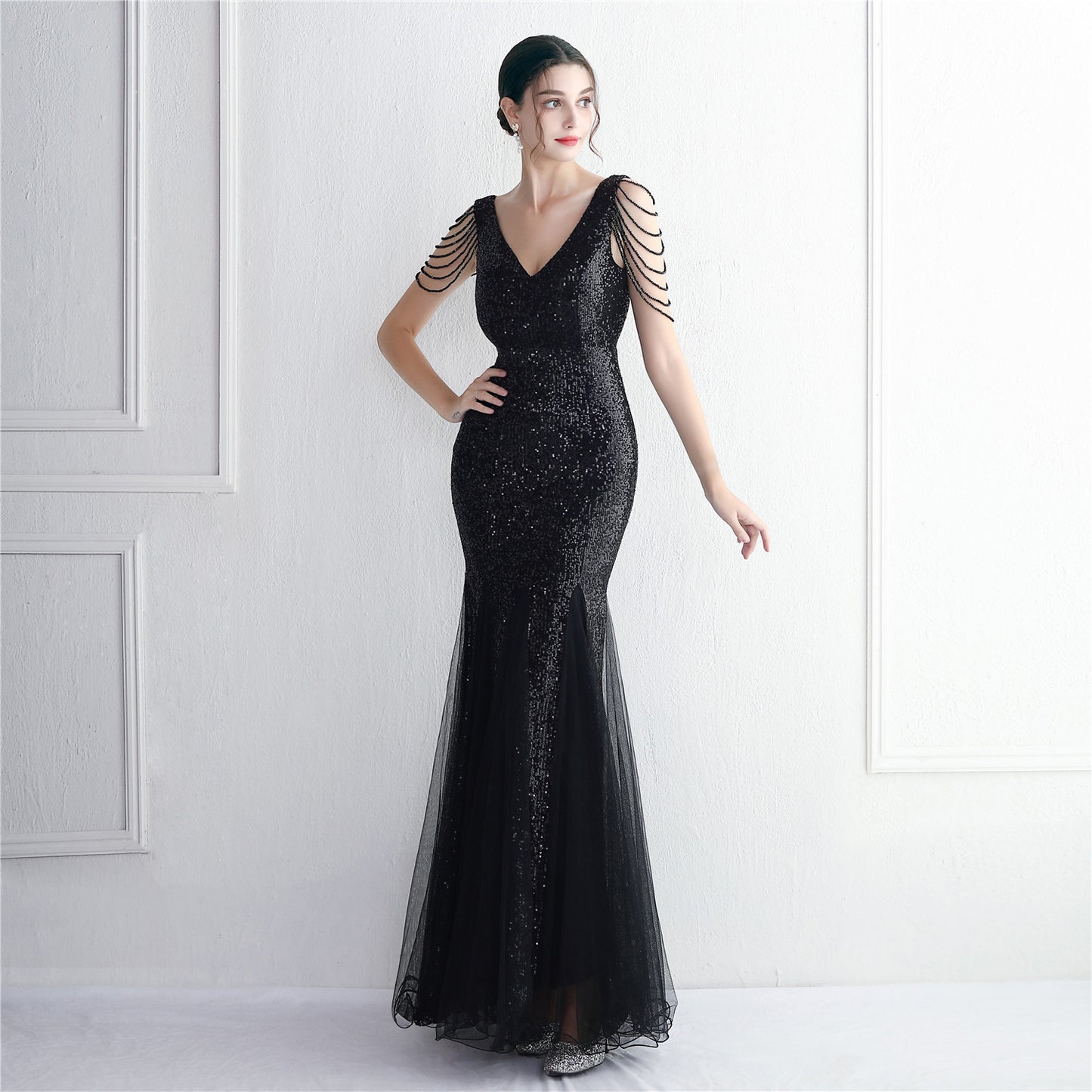 Robe de soirée longue en maille à paillettes et perles