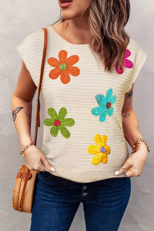 Top de punto de crochet con flores de colores blancos