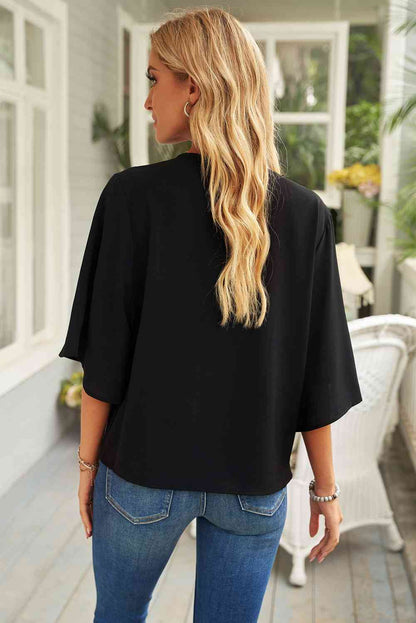 Blouse à col bénitier et manches trois-quarts