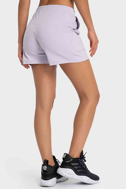 Short de sport à taille élastique avec poches