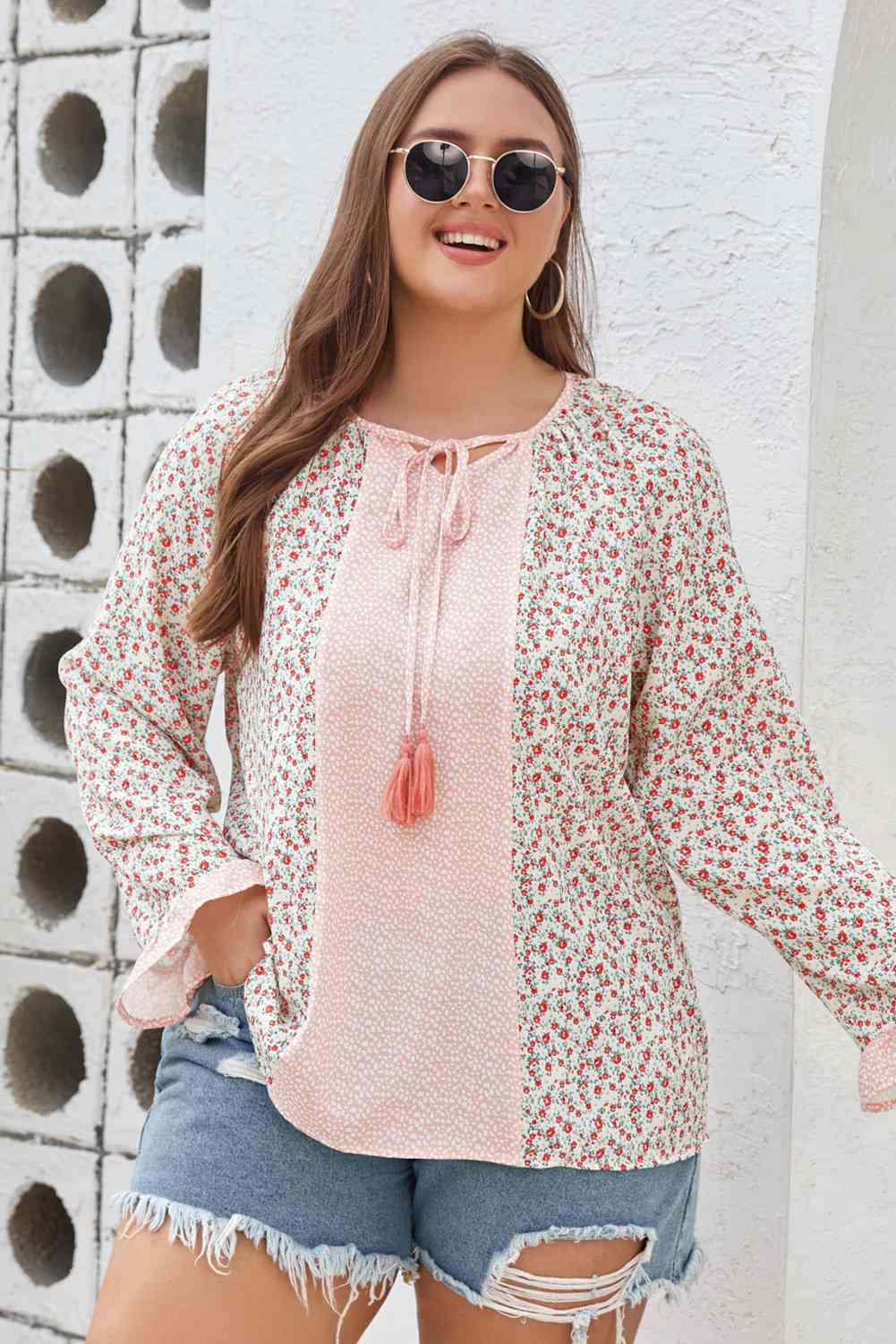 Blusa de manga con volante y borlas de talla grande