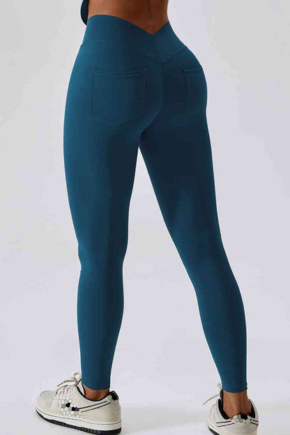 Legging de sport coupe slim avec large ceinture et poche arrière