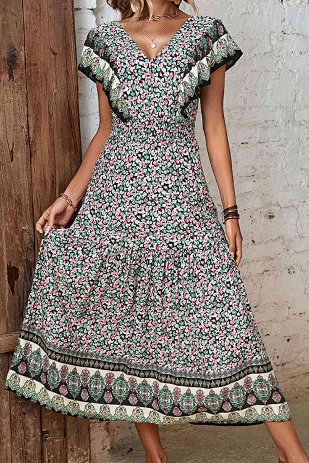 Vestido escotado con volantes y flores de florecitas