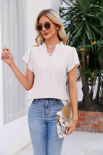 Blouse à manches bouffantes et col cranté