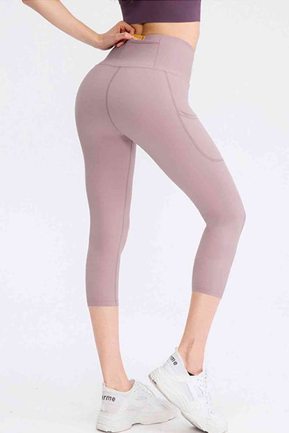 Leggings activos recortados con cintura ancha y bolsillos