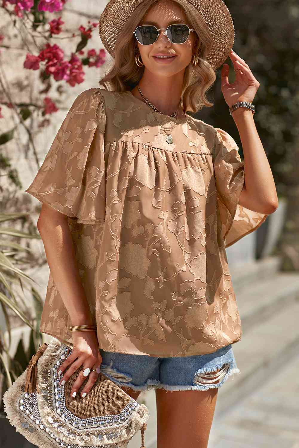 Blusa con cuello redondo y manga abullonada