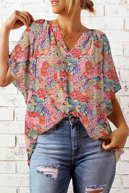 Blusa floral con cuello con muescas y mangas acampanadas