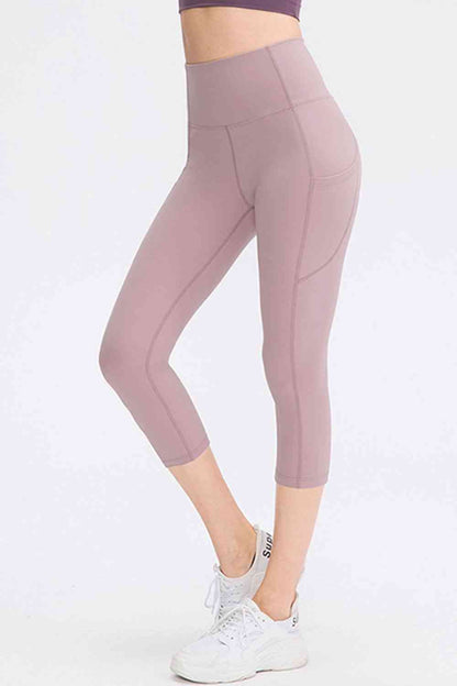 Leggings activos recortados con cintura ancha y bolsillos