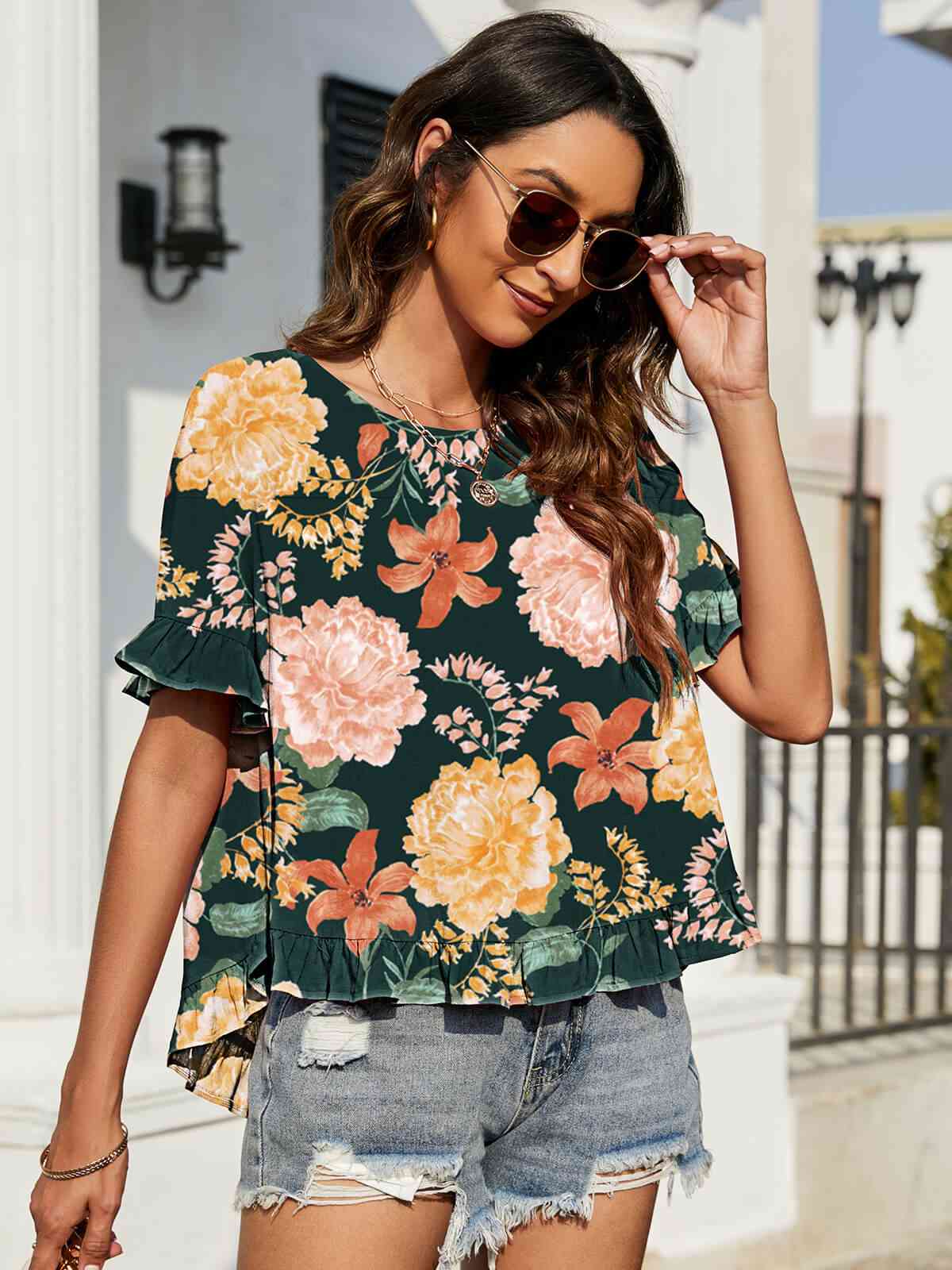 Blusa floral con mangas con volantes y volantes