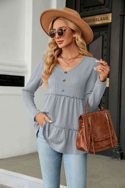 Blusa de punto de ochos con cuello en V y manga larga