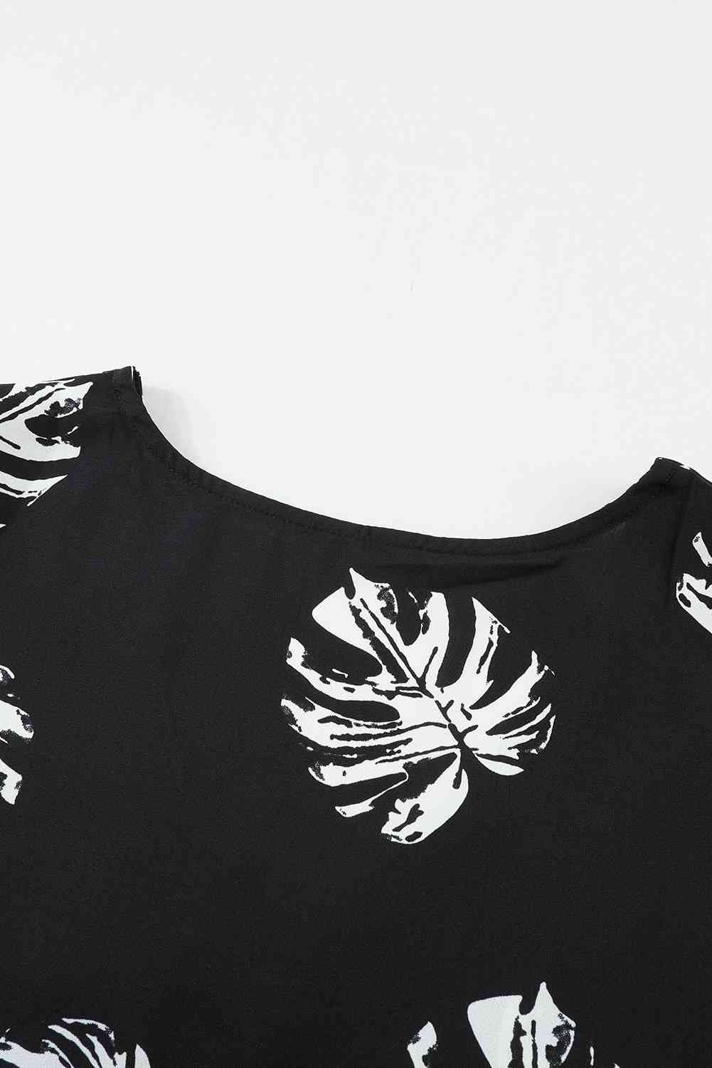 Blusa con manga abullonada y cuello en V con estampado botánico