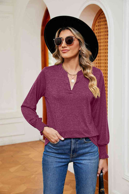 Blusa de manga larga con cuello con muescas