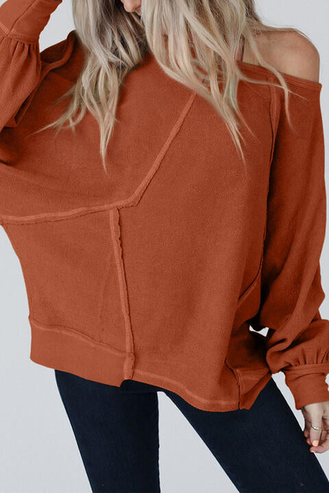 Blusa de manga larga con detalle de costura