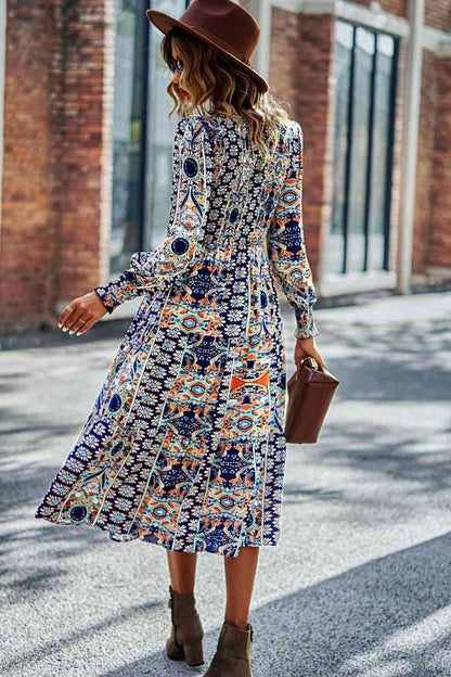 Robe midi smockée à col rond et manches lanternes