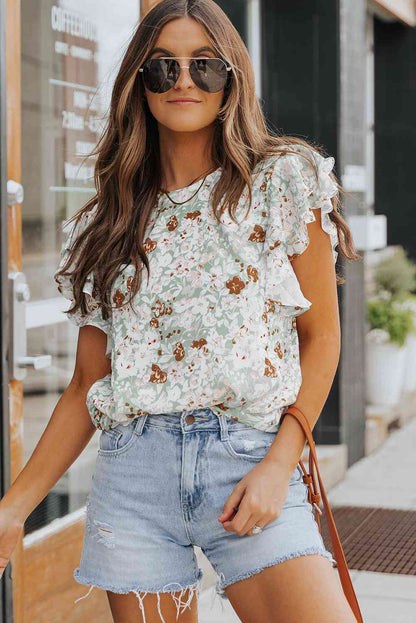 Blusa floral con mangas acampanadas y volantes