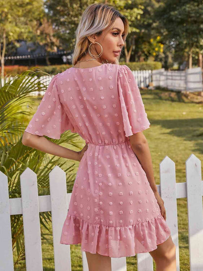 Robe à col surplis et pois suisses