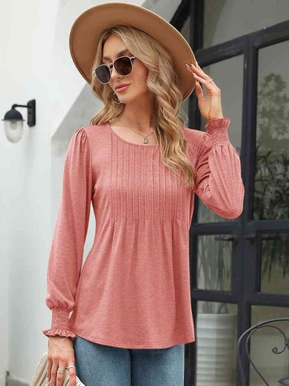 Blouse smockée à col rond et manches lanternes