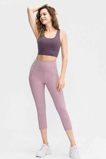 Leggings activos recortados con cintura ancha y bolsillos