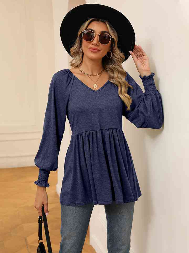 Blusa con mangas farol y cuello en V