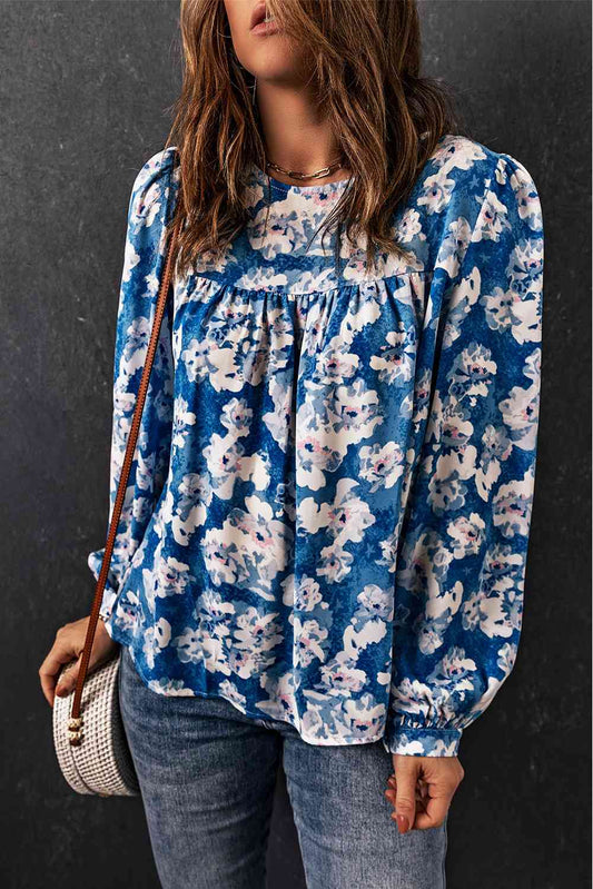 Blusa floral con cuello redondo y manga globo