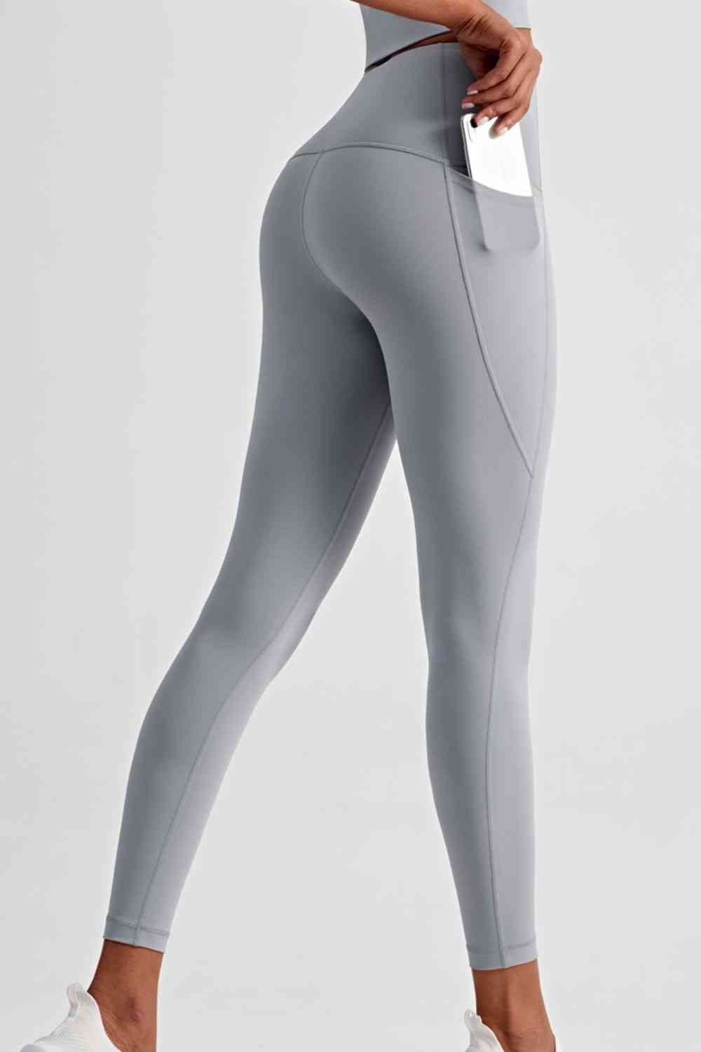 Leggings deportivos de cintura ancha con bolsillos laterales