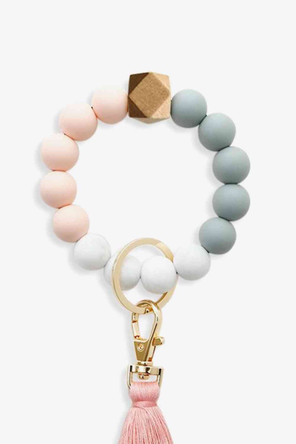 Paquet de 3 porte-clés avec bracelet en perles et pompon