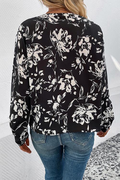 Top de manga larga con cuello y cuello floral