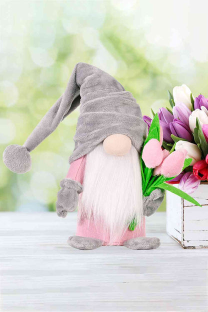 Gnome en peluche mignon debout avec tulipe 