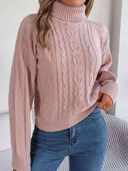 Pull à col roulé en tricot torsadé