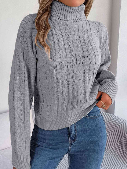 Pull à col roulé en tricot torsadé