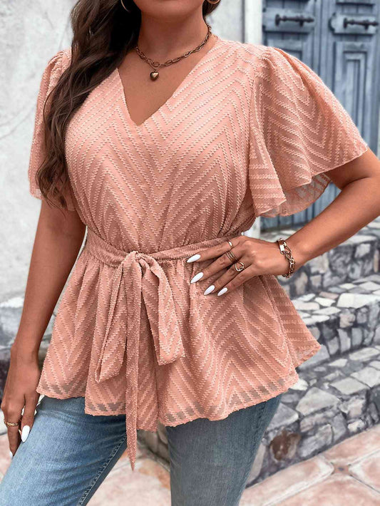 Blusa con cintura anudada y mangas acampanadas con cuello en V de talla grande