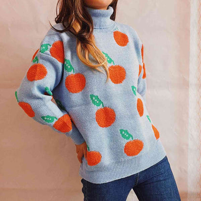 Pull à col roulé et motif de fruits