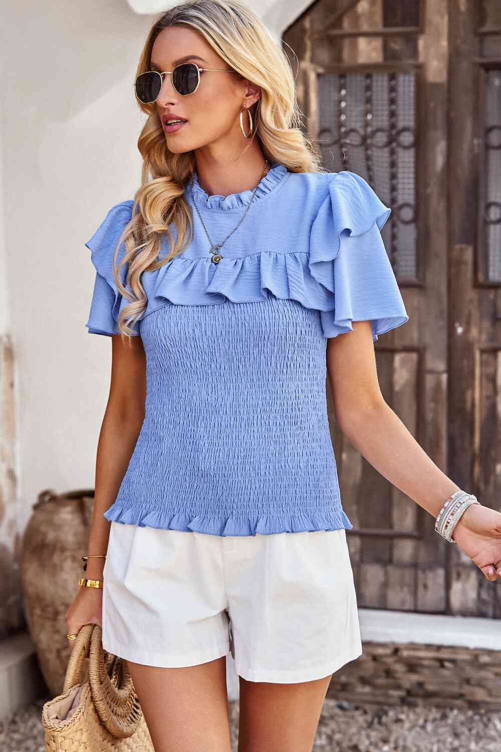 Blouse smockée à manches flottantes et nouée au dos