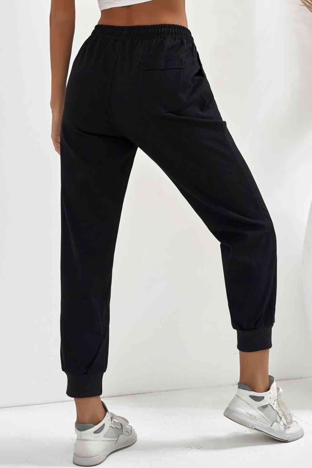 Pantalon de jogging avec poche à taille élastique et cordon de serrage