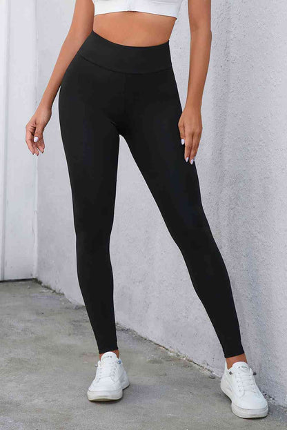 Leggings con cintura ancha y detalle cruzado