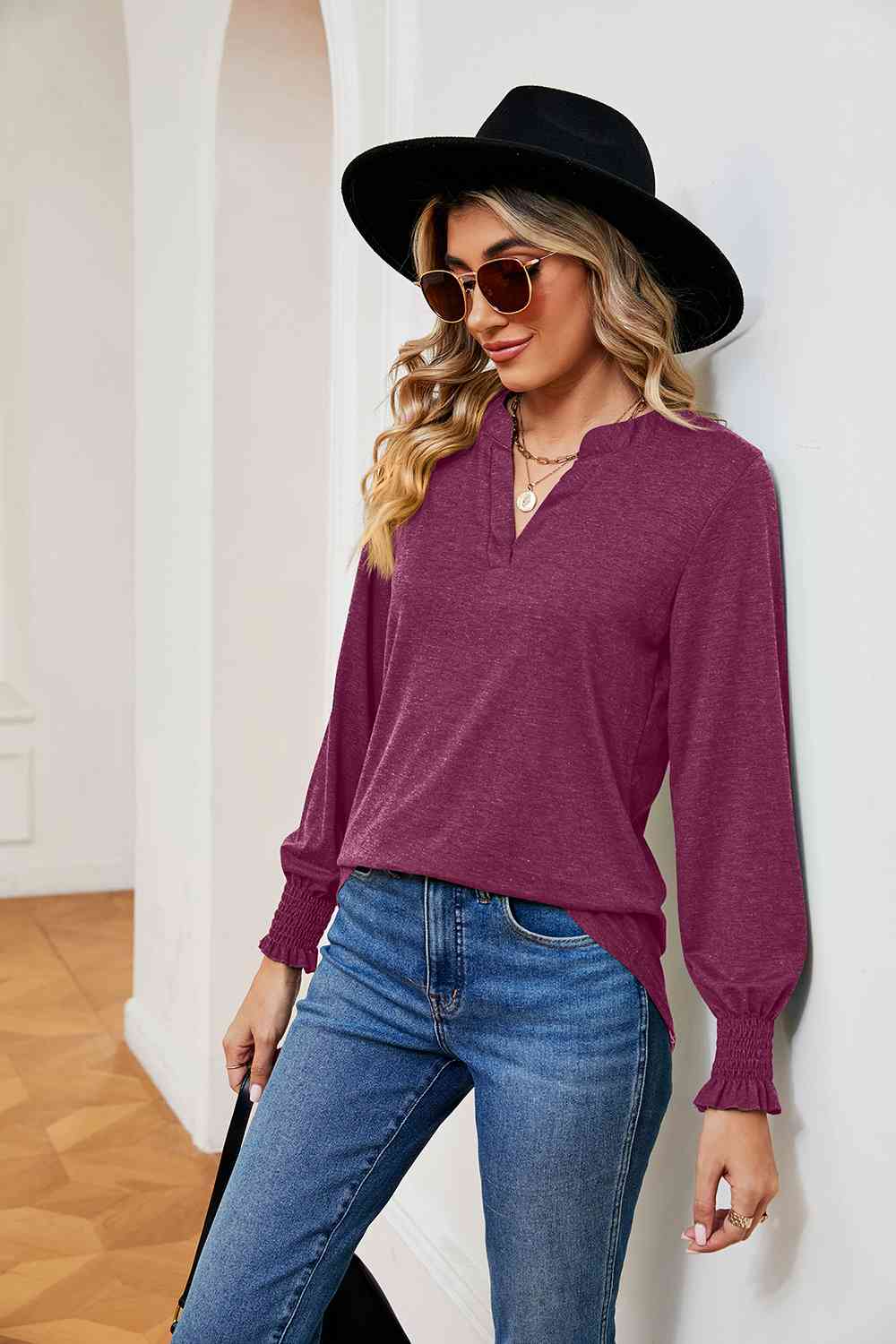 Blusa de manga larga con cuello con muescas