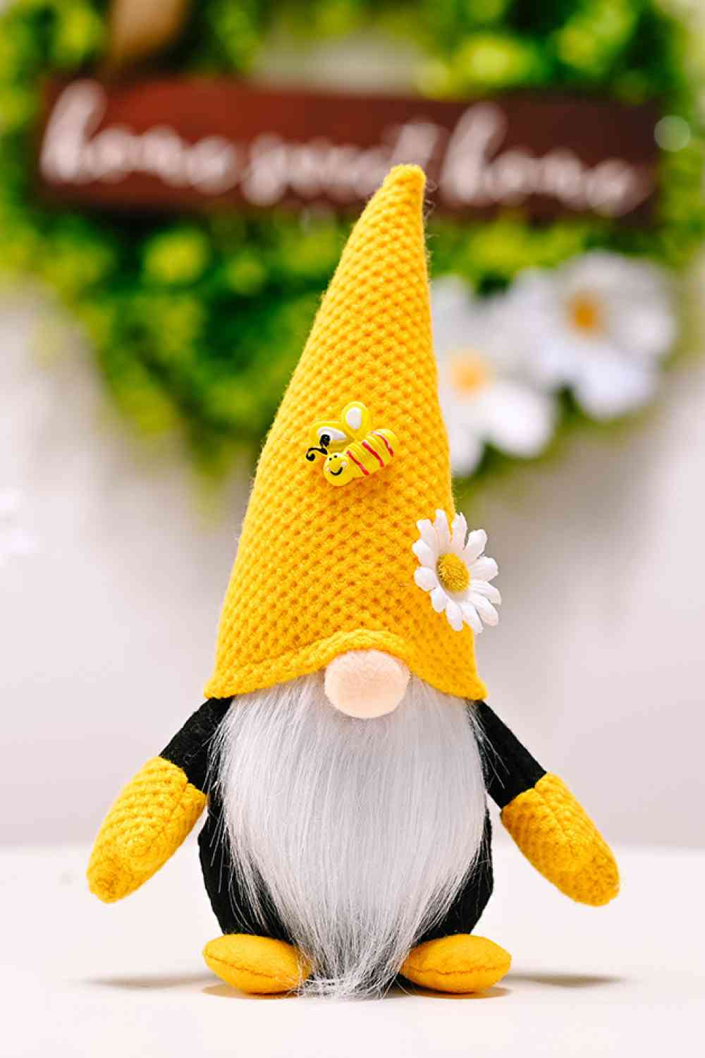 Gnome sans visage à décor d'abeille et de fleurs