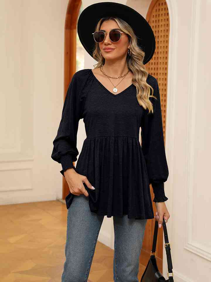 Blusa con mangas farol y cuello en V