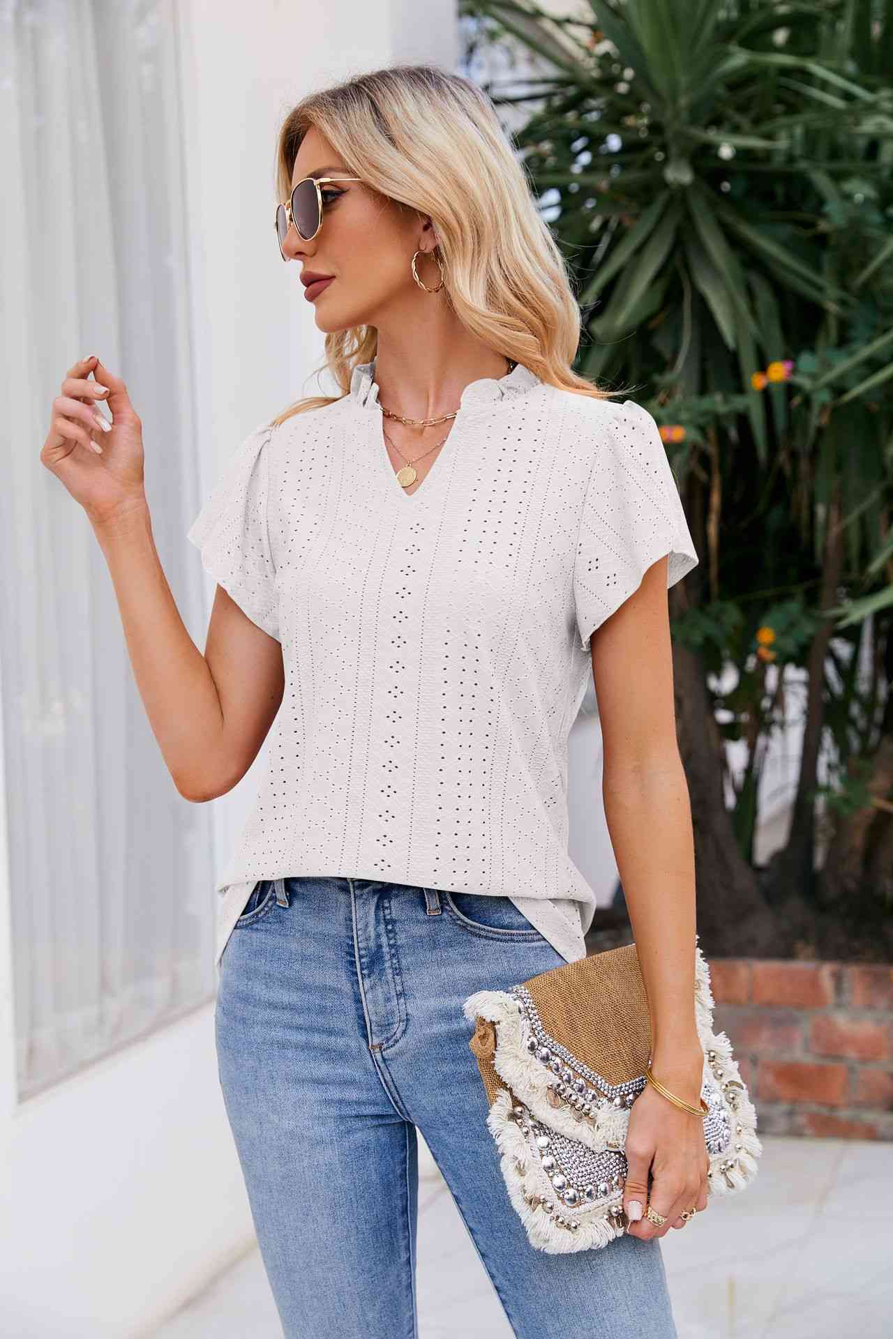 Blouse à manches bouffantes et col cranté