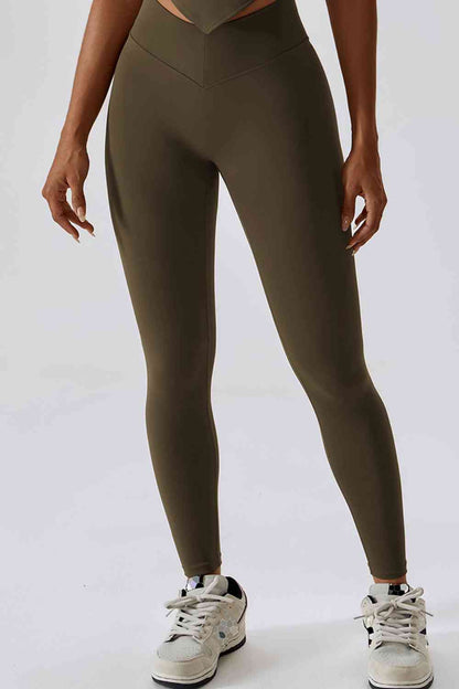 Legging de sport coupe slim avec large ceinture et poche arrière