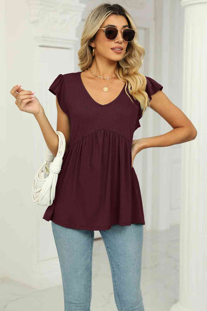 Blusa babydoll con mangas acampanadas y cuello en V