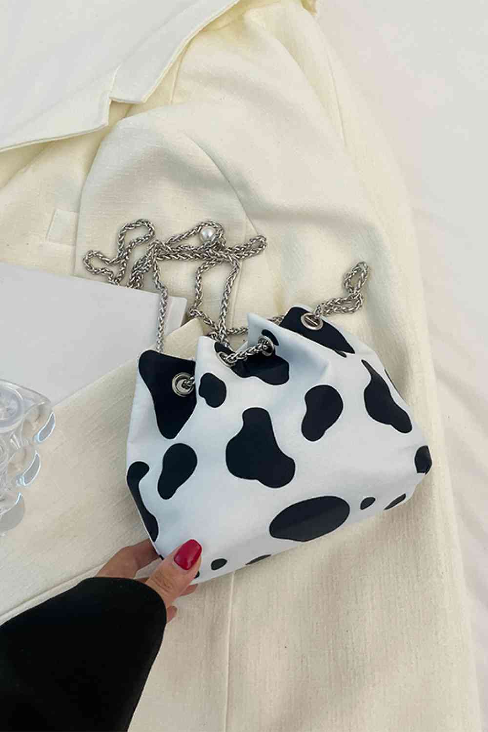 Bolso bombonera de nailon con estampado animal