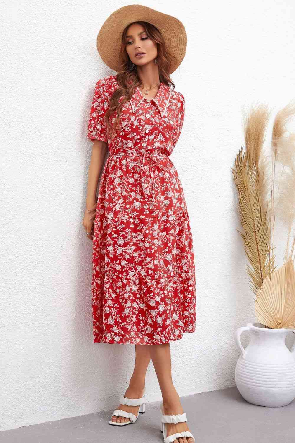 Robe mi-longue florale à manches bouffantes et taille nouée