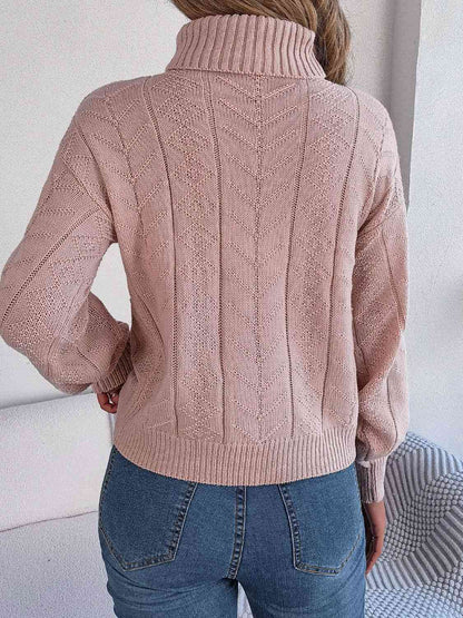 Pull à col roulé en tricot torsadé