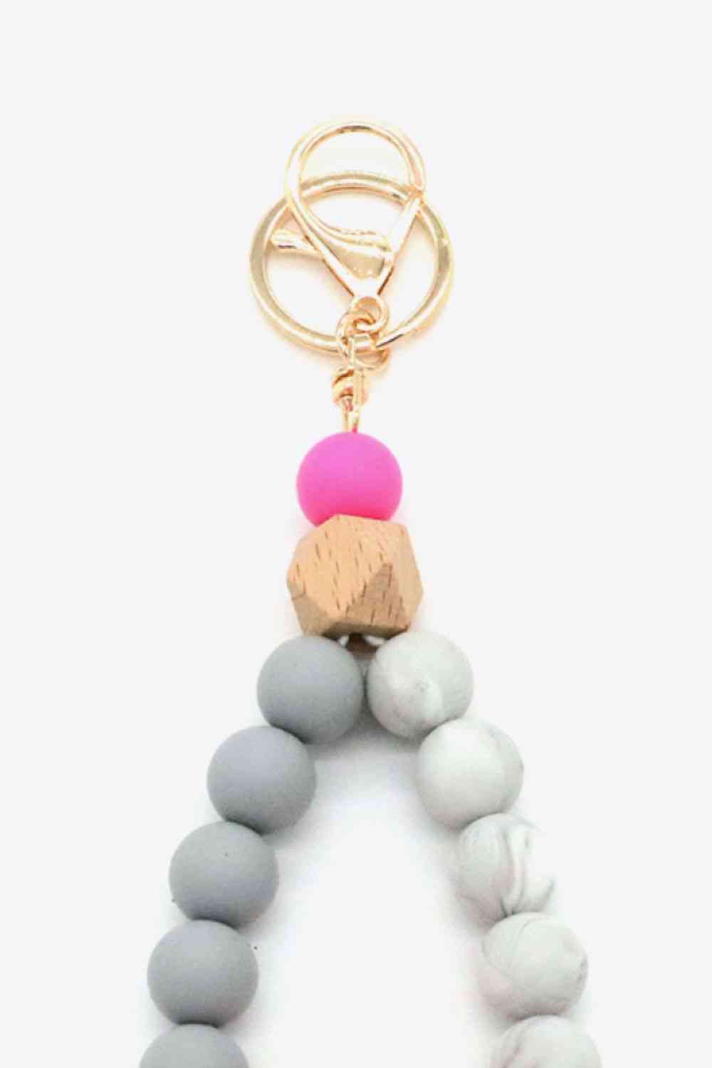 Assortiment de 2 porte-clés avec bracelet en perles multicolores