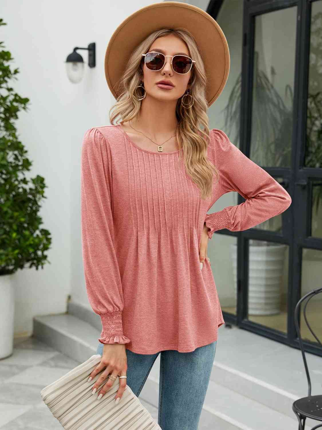 Blouse smockée à col rond et manches lanternes