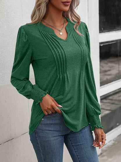 Blusa fruncida con cuello con muescas y mangas abullonadas