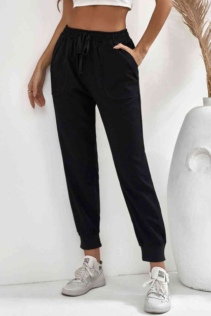 Pantalon de jogging avec poche à taille élastique et cordon de serrage