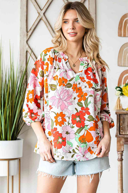 Blusa floral con cuello con muesca y manga globo